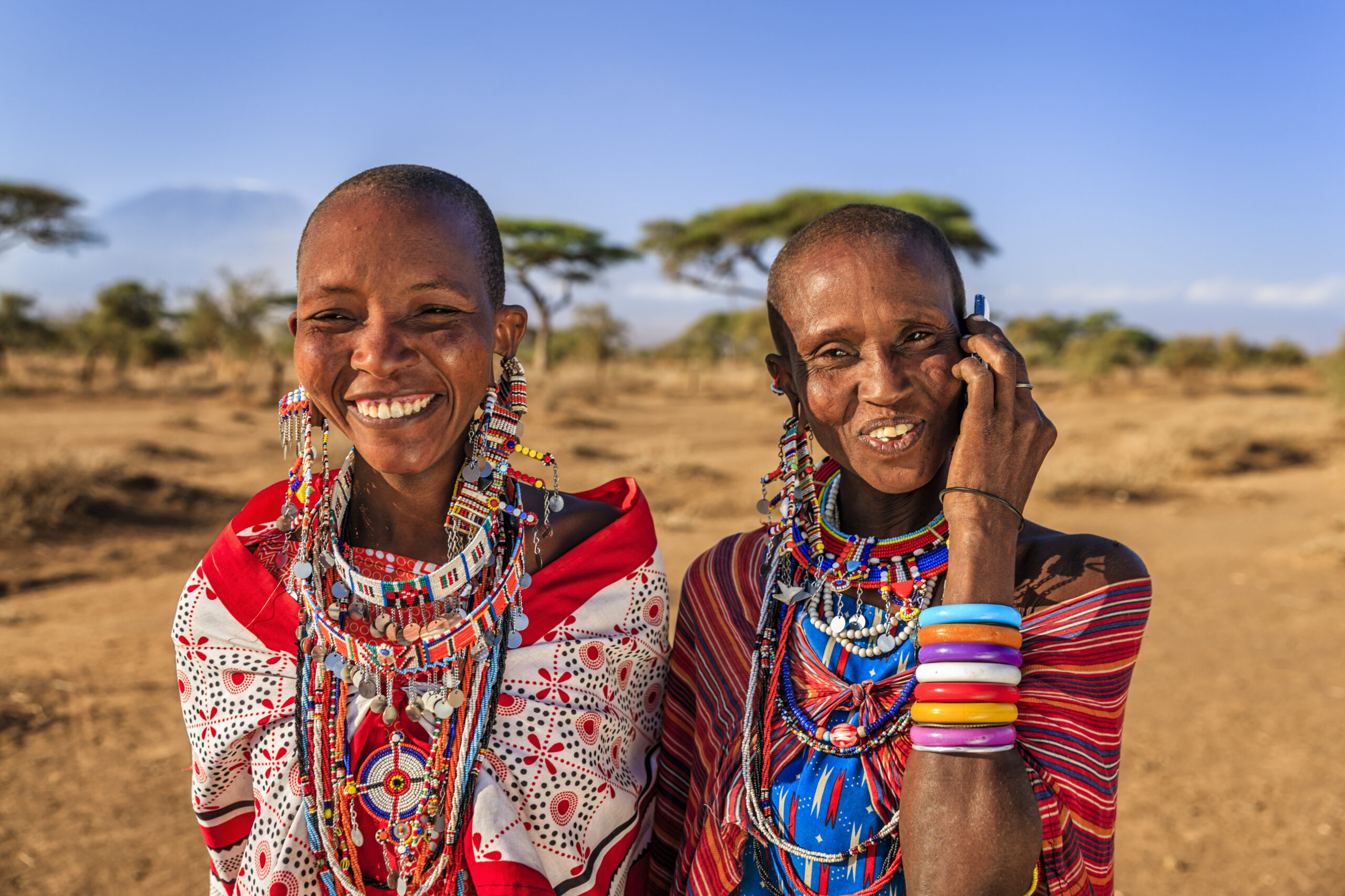 Woman from Maasai tribe using mobile phone, Kenya, Africa